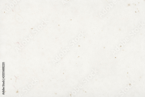 Fotografie White textured paper background with subtle speckles