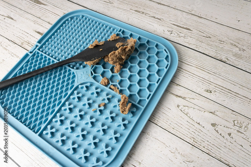 Silicone board for a dog to lick, providing mental stimulation.