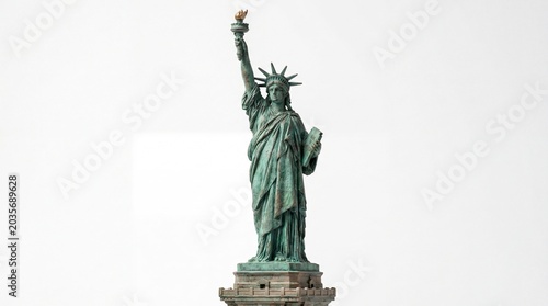 The statue of liberty standing tall with torch raised high on pedestal