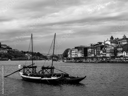 Boat on River with Porto Skyline in Black and White