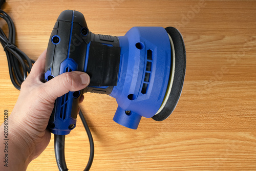 Orbital sander on a flat surface, sander isolated