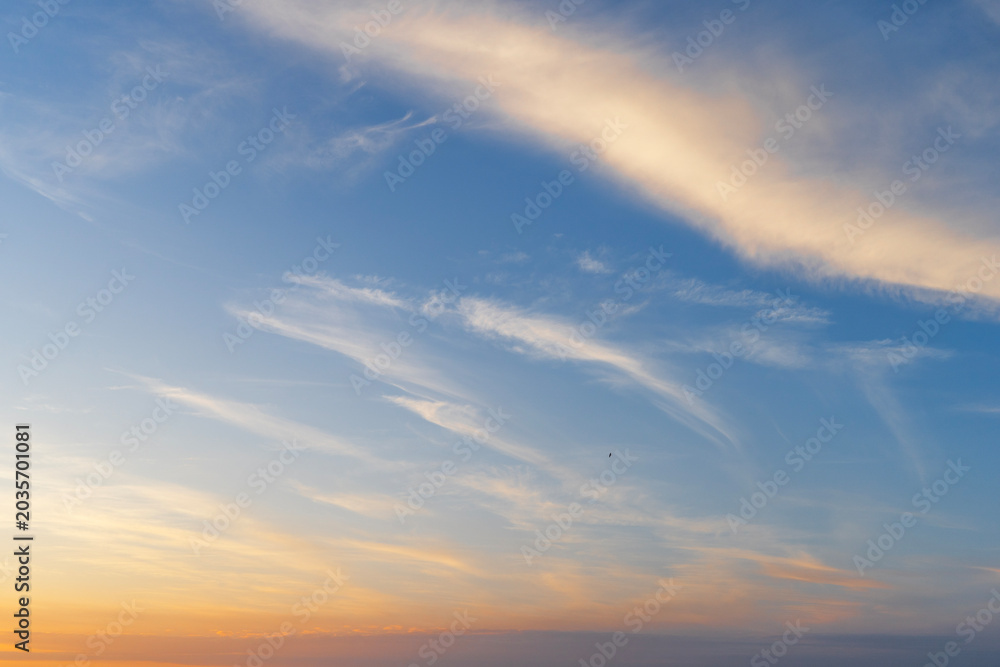 Fototapeta premium Clouds at sunset on the sky.