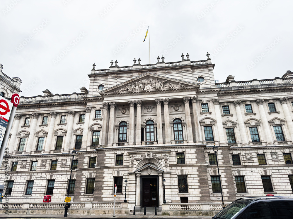 Fototapeta premium Grand neoclassical HMRC Whitehall historic building facade with columns and pediment in London, UK city center