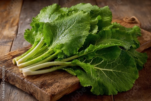 Rustic kitchen still life featuring fresh turnip greens in natural daylight