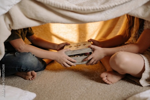 The Floorboard Secret, Childhood Oaths, Children Sharing a Decorative Box Inside a Cozy Fort