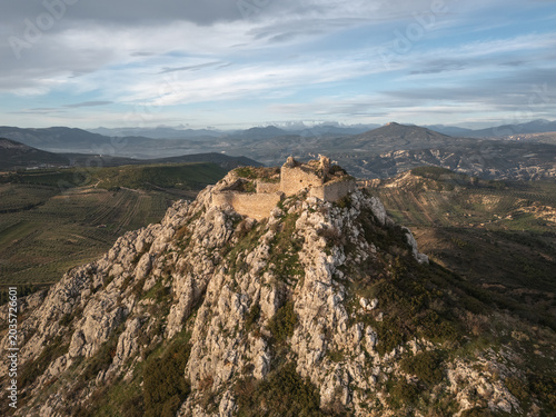 Drone view of ancient Penteskoufi castle ruins on rocky mountain in Greece