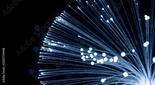 Sparkling Fireworks Explosion in Night Sky with Bright Blue and White Light Trails