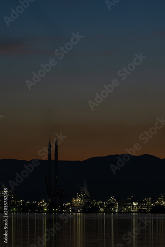 Shunan Industrial Complex Night View with Twin Smokestacks and Water Reflections