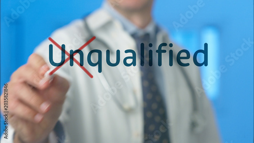 Photography Doctor eliminating the unqualified word from a transparent display, symbolizing