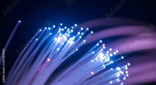 Glowing Fiber Optic Strands Curving in Dark Blue Purple Background