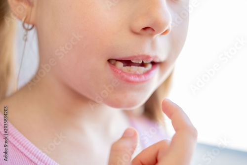 Fotografija little girl practicing speech therapy exercises, lip tongue articulation trainin