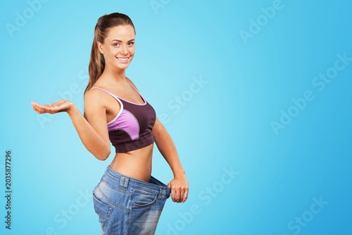 Photos Happy dieter concept, woman with big pants