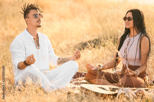 Young couple of hippies wit...