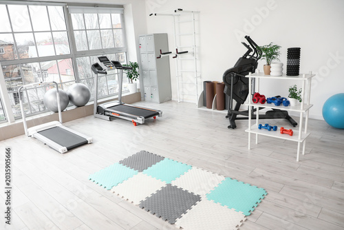 Interior of gym with treadm...