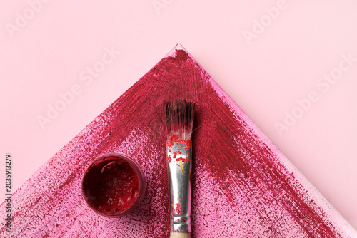 Artist brush, paint and can...