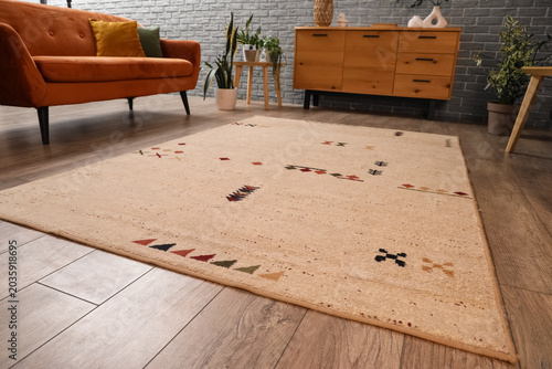Beige carpet on floor in li...