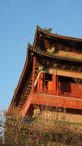 The old Forbidden city in Peking in winter with the warm sunset sunlight on them