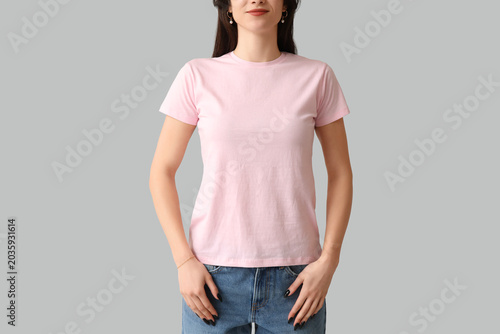 Young woman in stylish pink...