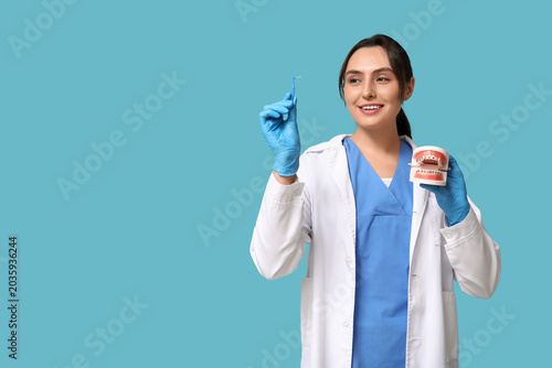 Young female dentist with b...