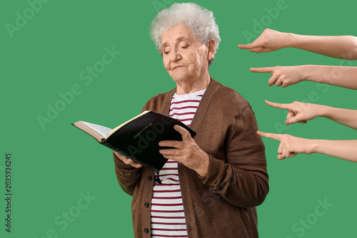People pointing at senior w...