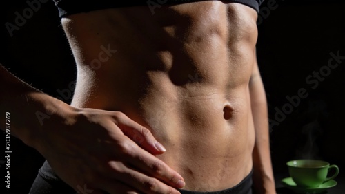 woman measuring her belly