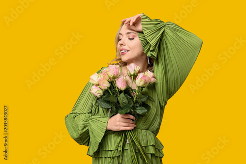 Young woman with bouquet of...