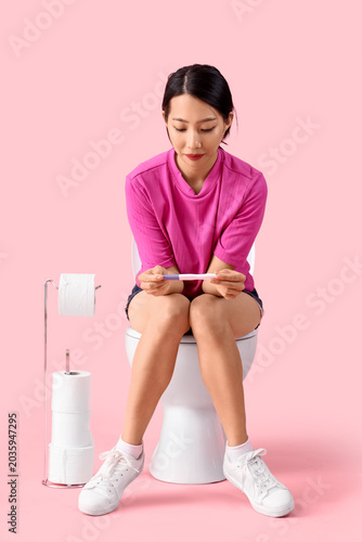 Young Asian woman with preg...