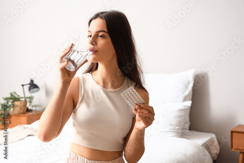 Young woman taking contrace...