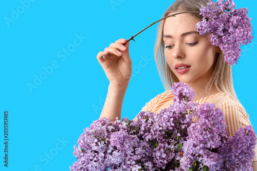 Young woman with lilac flow...