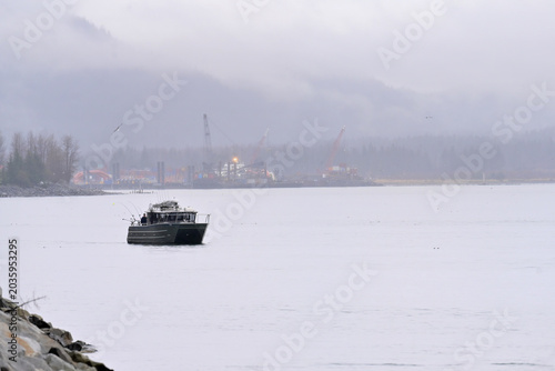Fishermen troll near shore on Resurrection Bay near Seward, Alaska.