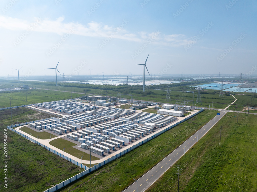 Fototapeta premium Aerial view of nantong energy storage power station and wind farm under blue sky