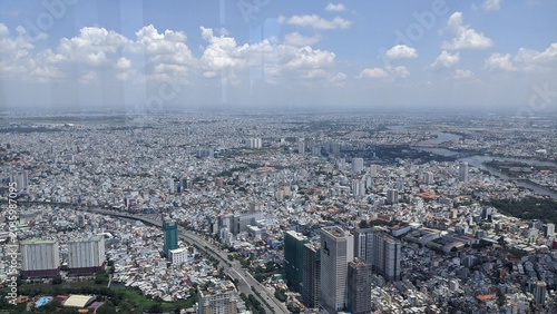 Cityscape in Ho Chi Minh City, Vietnam: Panoramic view of the skyline with the Saigon River and high-rise buildings in 2020