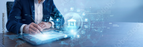 Canvas Print Bank manager using a tablet to review Banking transaction reports