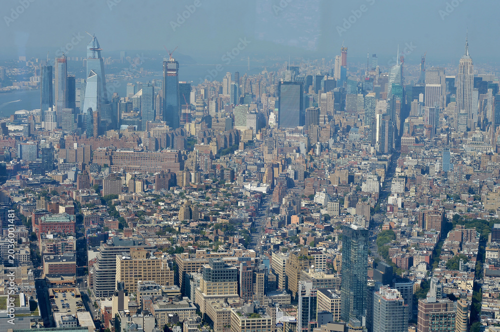 Obraz premium Skyline Street Scene. Urban Corridor With Towering Structures And Dense City Grid new york