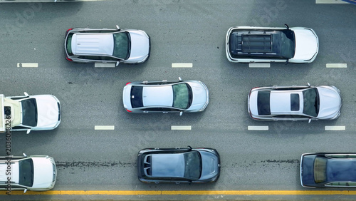 Εκτύπωση καμβά A drone view shows cars stuck in gridlock on a busy asphalt road, illustrating urban congestion, lost time, environmental concerns, urban planning issues, transportation challenges, and city living
