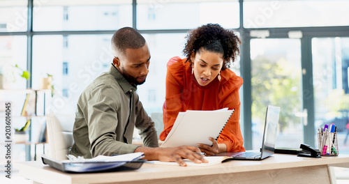 Document, business and people in office with advice, planning or review of resume for hiring. Application, portfolio and human resources team with paper for question, decision or career assessment