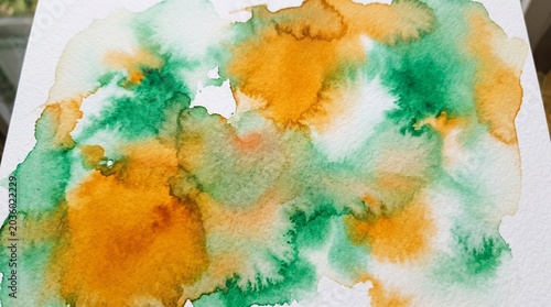 Saffron White and Green Watercolor Ink Bleeding on Wet Paper