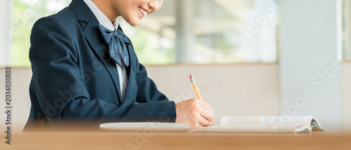 Fotografie Middle school and high school girls studying (homework, exam preparation, learni