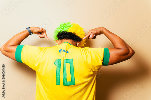 Brazil soccer fan proudly showing jersey number