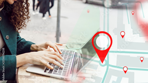 Cuadro en lienzo Person using laptop to find taxi route on map in city street during daytime