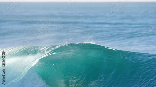 Beautiful Ocean Crest Illuminated By Sunlight. Calm And Powerful Ocean Wave Captured In Slow Motion