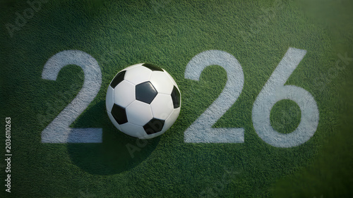 Soccer ball on a green field with 2026 marking