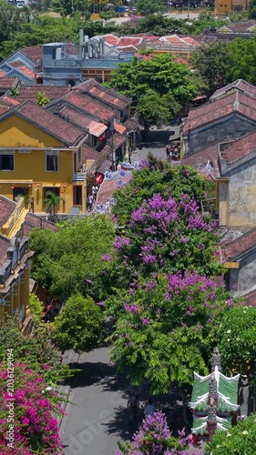 Aerial drone view of Hoi An city, Quang Nam province, Vietnam. Panoramic footage of Ancient town, UNESCO world heritage. One of the most travel popular touristic destinations