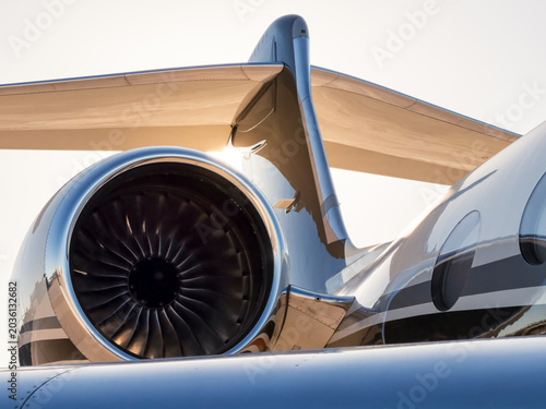 Luxury private jet engine and tail close up