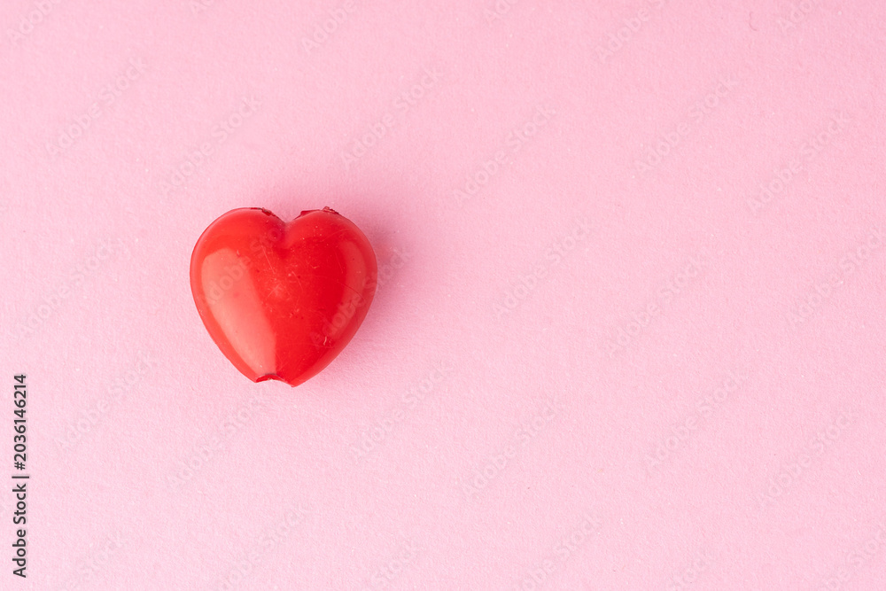 Fototapeta premium red heart on a pink background