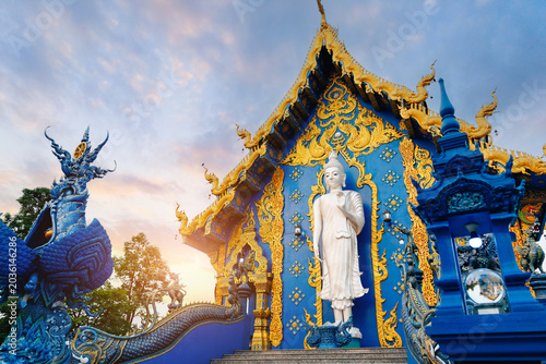 Photography Wat Rong Suea Ten, Blue temple complex at sunset glow Chiang Rai, Thailand with