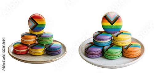 Two stacks of colorful pride flag macarons on ceramic plates isolated on transparent background