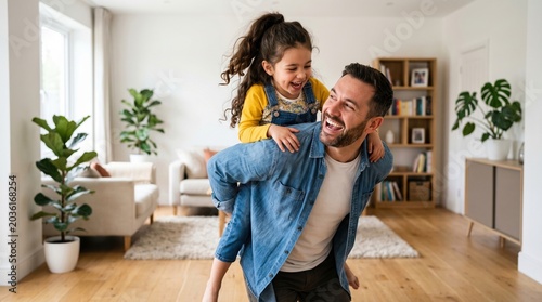 Father carrying his daughter on his shoulders in a modern living room with one person two people wood floor home life