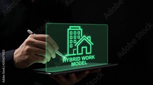 Hand interacting with digital hybrid work model concept interface on dark background.