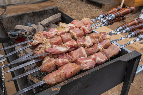Quadro su tela shish kebab shashlik on the barbecue skewers. Cooking process